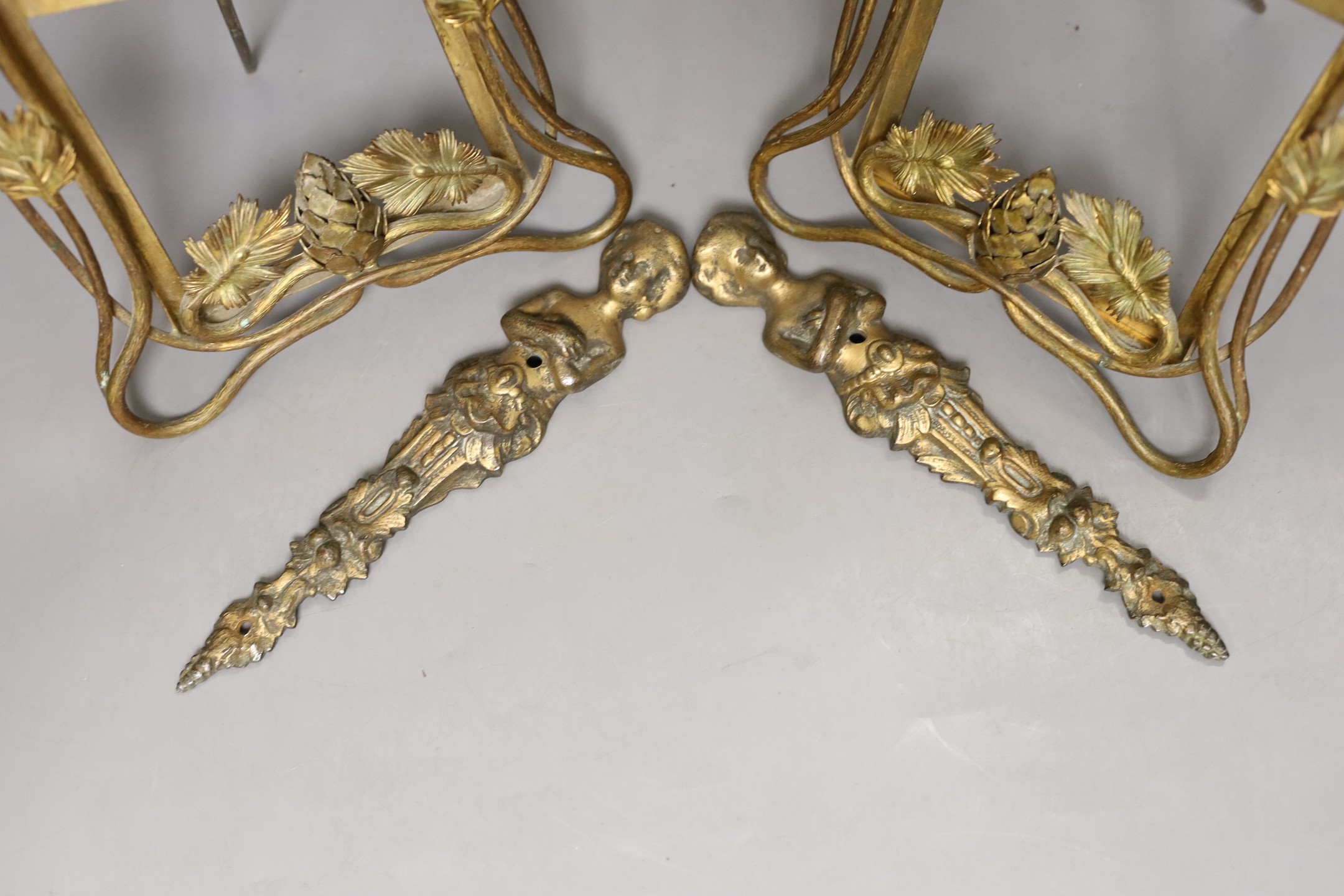 A pair of late 19th century brass photo frames, 20.5 cm high, and a pair of bronze furniture mounts